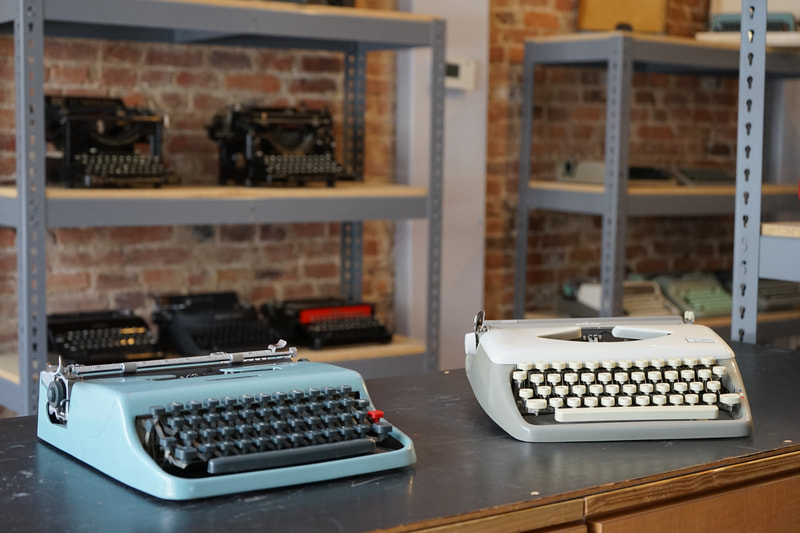 Photo of two European Ultra-Portable Typewriters, the 1950 Olivetti Lettera 22 and the 1964 Adler Tippa